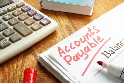 Notepad with 'Accounts Payable' written on in red pen